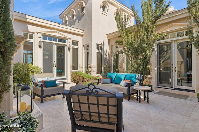 view of patio / terrace with an outdoor living space and french doors