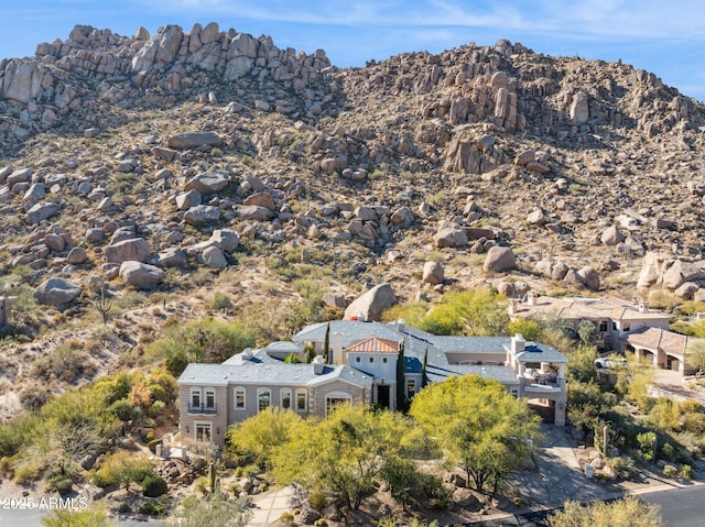 birds eye view of property with a mountain view