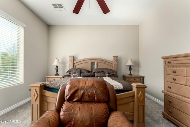 bedroom featuring carpet floors, multiple windows, and visible vents