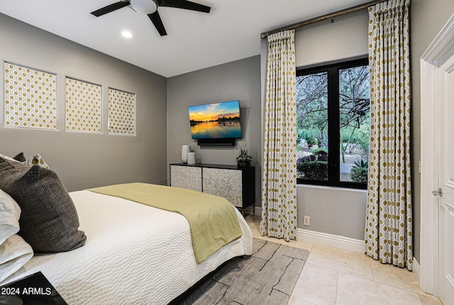 bedroom featuring ceiling fan and light tile patterned floors