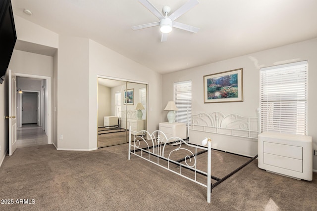 living area featuring baseboards, a ceiling fan, vaulted ceiling, and carpet flooring