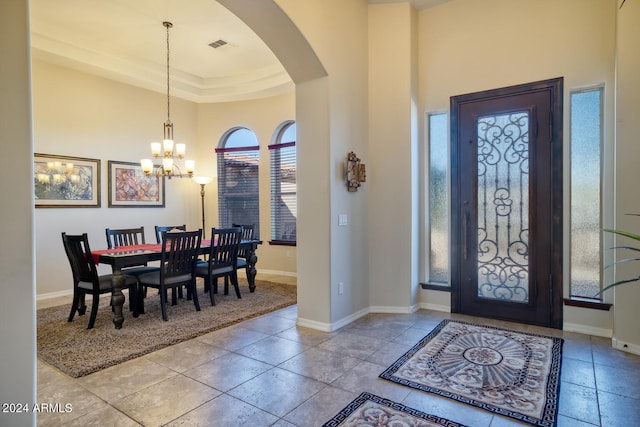 foyer featuring an inviting chandelier