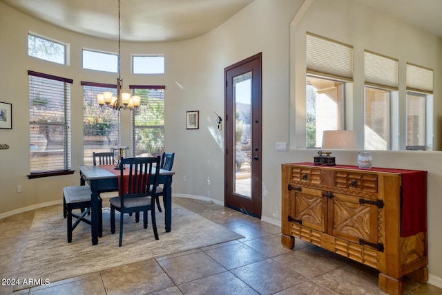 dining room featuring a chandelier and a healthy amount of sunlight