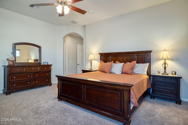 bedroom with light colored carpet and ceiling fan