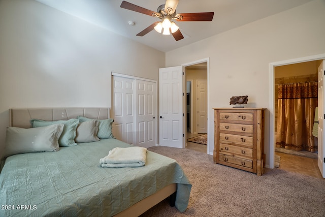 carpeted bedroom with ceiling fan and a closet