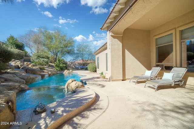 view of swimming pool featuring a patio and pool water feature