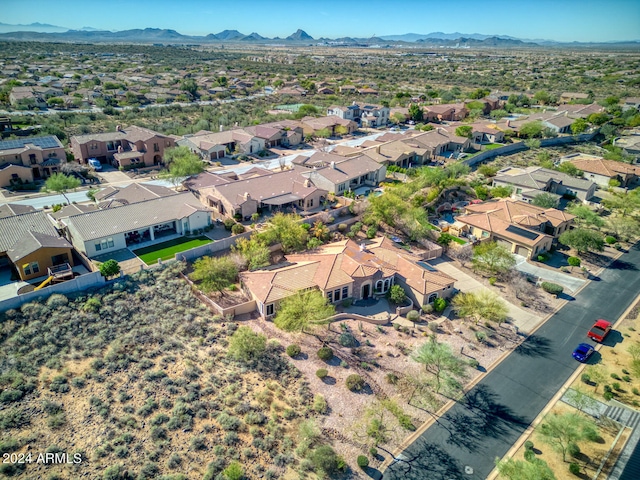 birds eye view of property featuring a mountain view