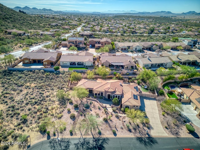 birds eye view of property featuring a mountain view