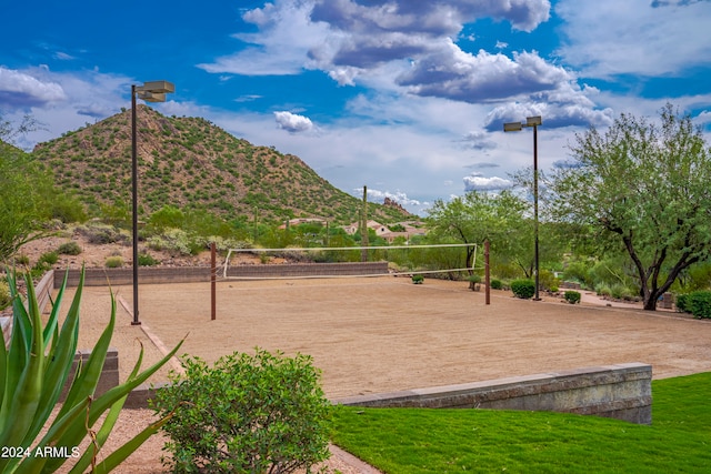 view of home's community with volleyball court and a mountain view