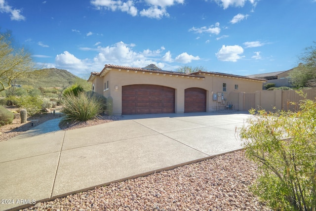 view of front of house with a mountain view and a garage