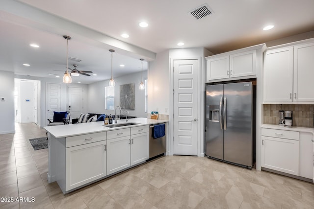 kitchen featuring sink, white cabinets, ceiling fan, and appliances with stainless steel finishes