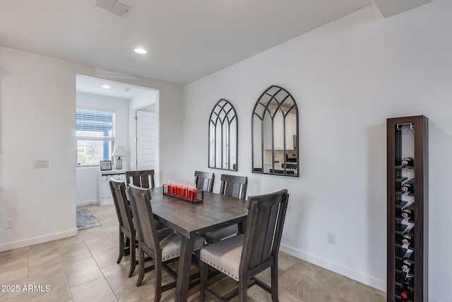 dining area with light tile patterned floors