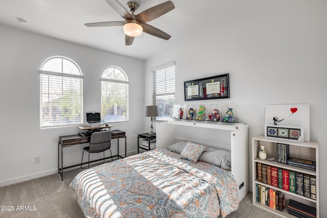 bedroom with ceiling fan and light colored carpet