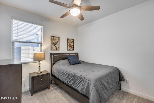 bedroom featuring ceiling fan and light carpet