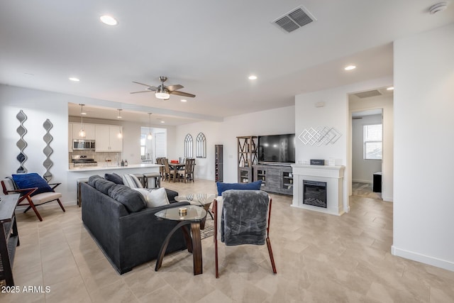 living room featuring ceiling fan