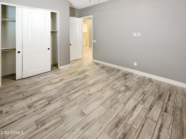 unfurnished bedroom featuring light hardwood / wood-style floors