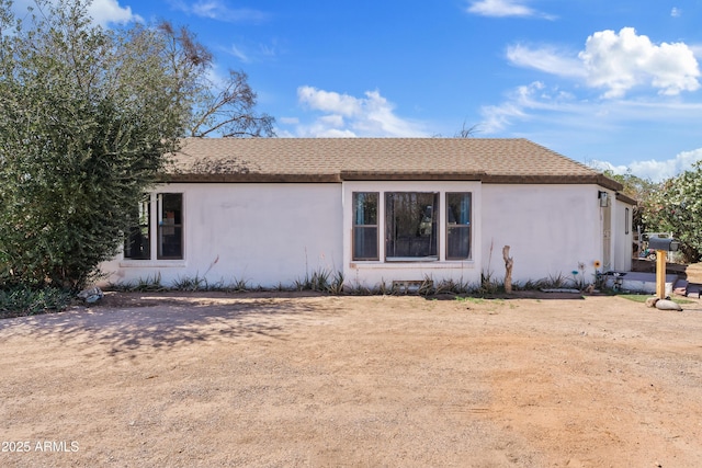 599 W Vah Ki Inn Rd, Coolidge, AZ 85128 - view of home's exterior featuring stucco siding and a shingled roof