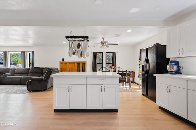 599 W Vah Ki Inn Rd, Coolidge, AZ 85128 - kitchen with light wood-style flooring, backsplash, recessed lighting, light countertops, and white cabinetry