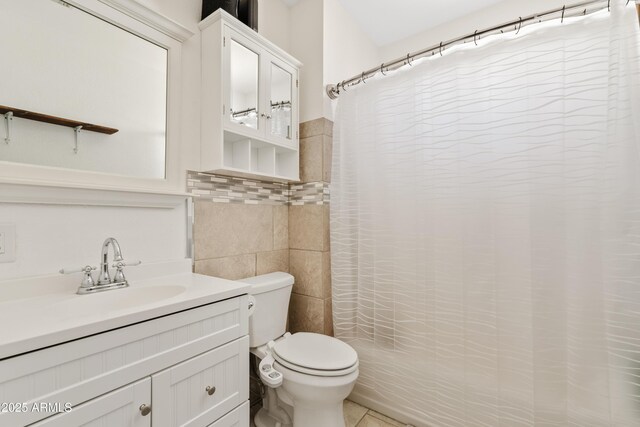 599 W Vah Ki Inn Rd, Coolidge, AZ 85128 - full bath with tile walls, toilet, a shower with shower curtain, vanity, and tile patterned flooring
