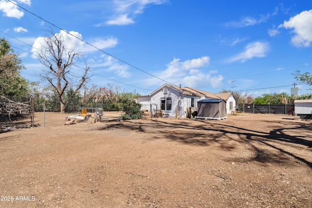 599 W Vah Ki Inn Rd, Coolidge, AZ 85128 - view of yard featuring fence, an outbuilding, and a shed