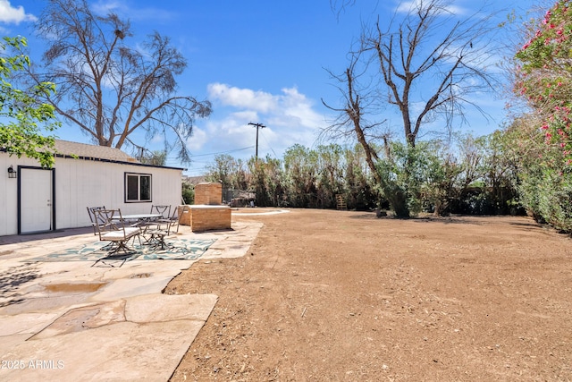 599 W Vah Ki Inn Rd, Coolidge, AZ 85128 - view of yard featuring a patio