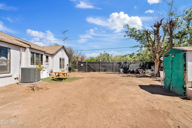 599 W Vah Ki Inn Rd, Coolidge, AZ 85128 - view of yard with central AC unit and fence