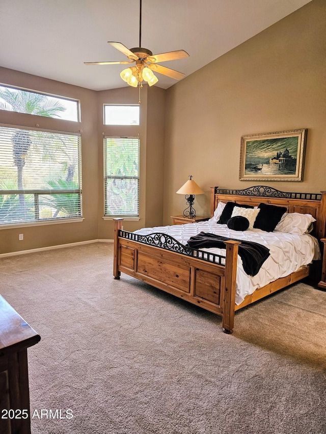 bedroom featuring ceiling fan, carpet floors, and vaulted ceiling