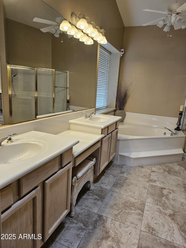 bathroom featuring ceiling fan, separate shower and tub, and vanity