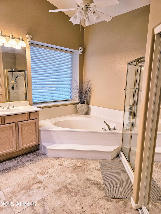 bathroom with ceiling fan, vanity, and independent shower and bath