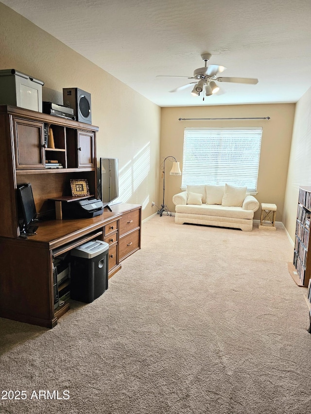 office featuring carpet floors and ceiling fan