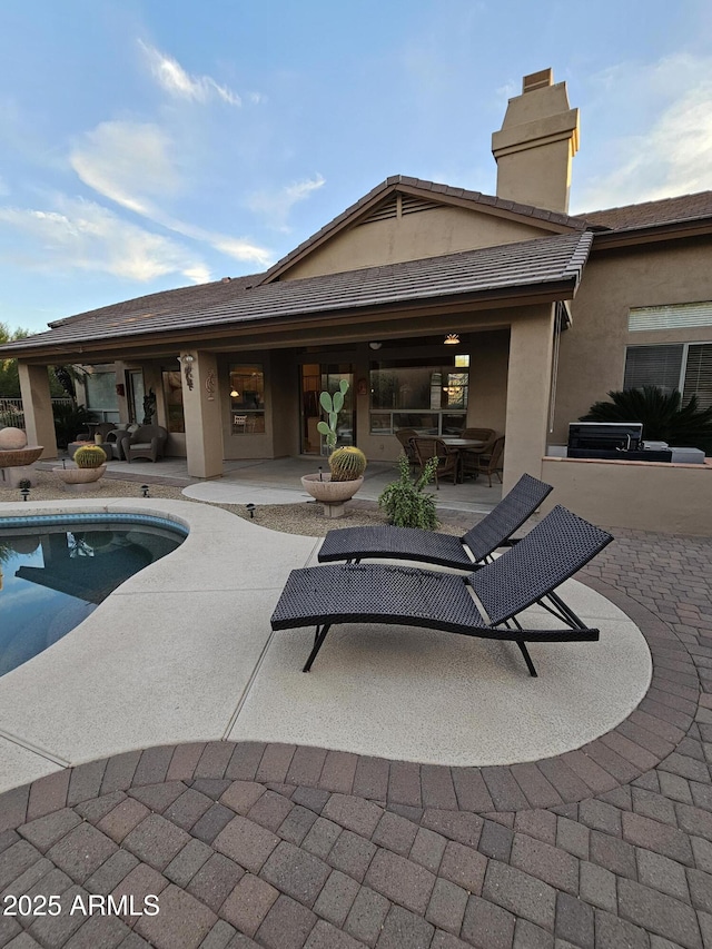 back of house with a patio area