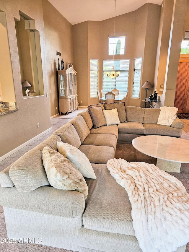 living room featuring a notable chandelier and vaulted ceiling