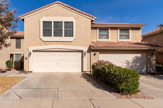 view of front of house featuring driveway and stucco siding