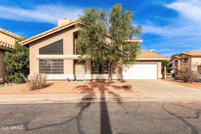 mediterranean / spanish-style home with a garage