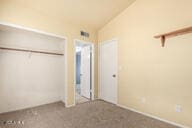 unfurnished bedroom featuring a closet and vaulted ceiling