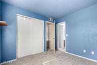 unfurnished bedroom featuring light colored carpet