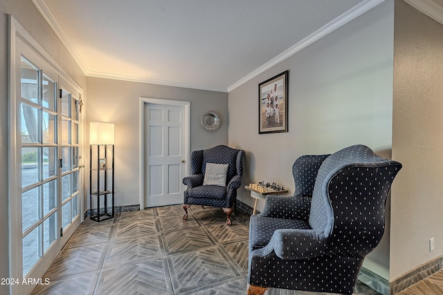 living area with baseboards and ornamental molding