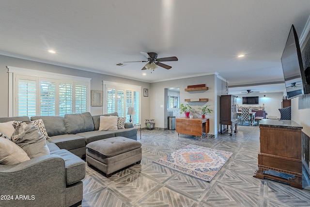 living room featuring ceiling fan, visible vents, ornamental molding, and recessed lighting