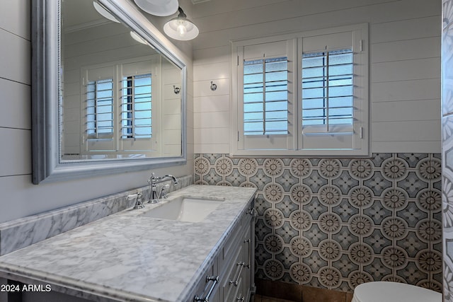 bathroom featuring toilet and vanity