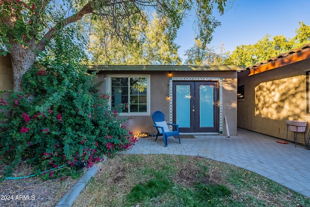 exterior space featuring french doors, a patio, and stucco siding