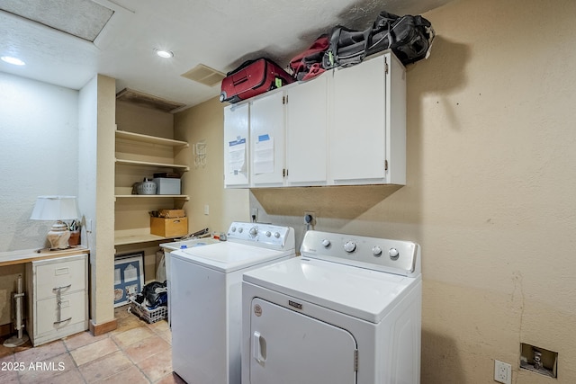 laundry room featuring washing machine and clothes dryer, recessed lighting, cabinet space, and attic access