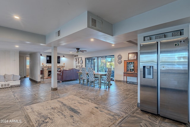 kitchen featuring recessed lighting, visible vents, open floor plan, and stainless steel fridge with ice dispenser