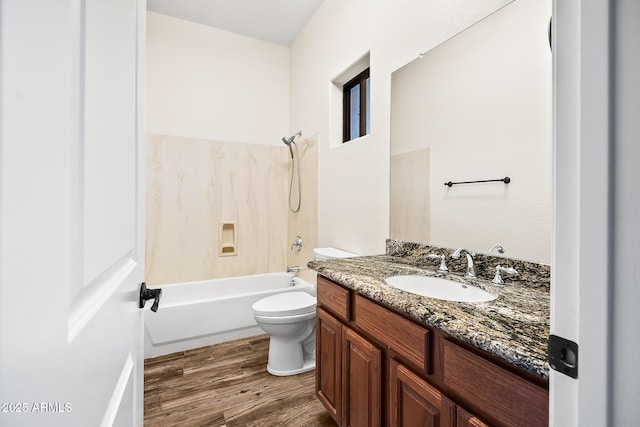 bathroom featuring vanity, shower / bathtub combination, wood finished floors, and toilet