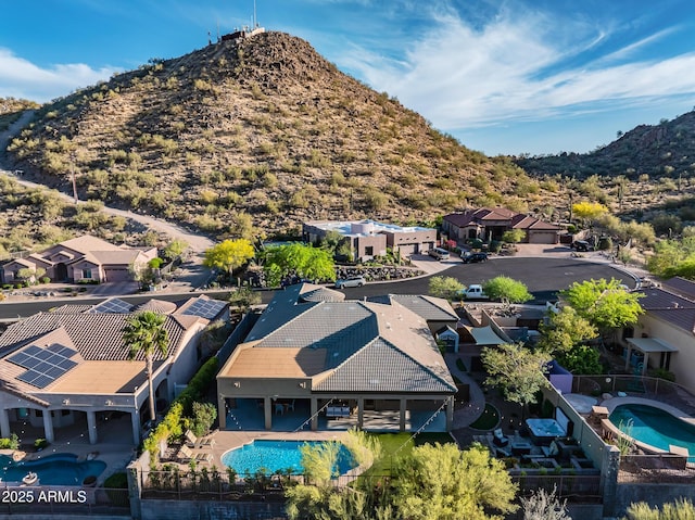 birds eye view of property featuring a mountain view