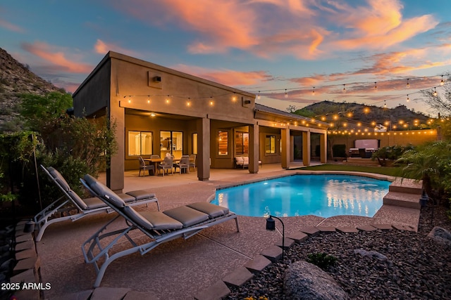 view of swimming pool with a patio and a fenced in pool