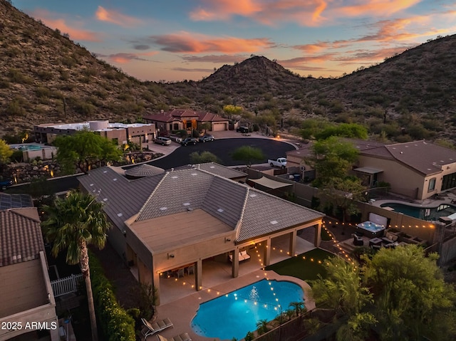 aerial view at dusk with a mountain view