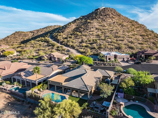 birds eye view of property with a mountain view and a residential view