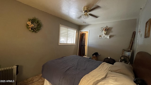 bedroom with ceiling fan, a spacious closet, and a closet