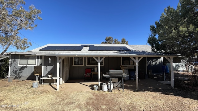 back of property with solar panels