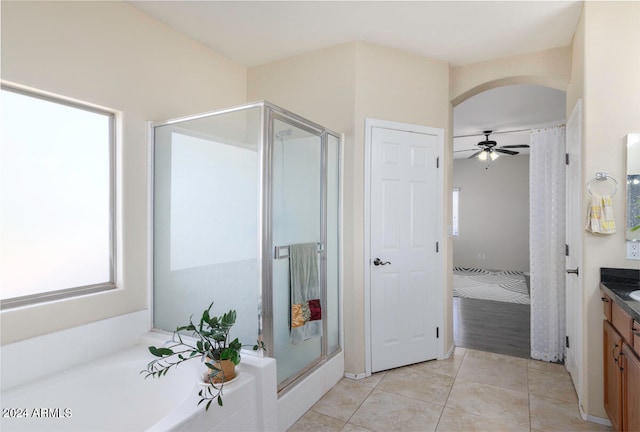 bathroom with ceiling fan, plus walk in shower, vanity, and hardwood / wood-style floors